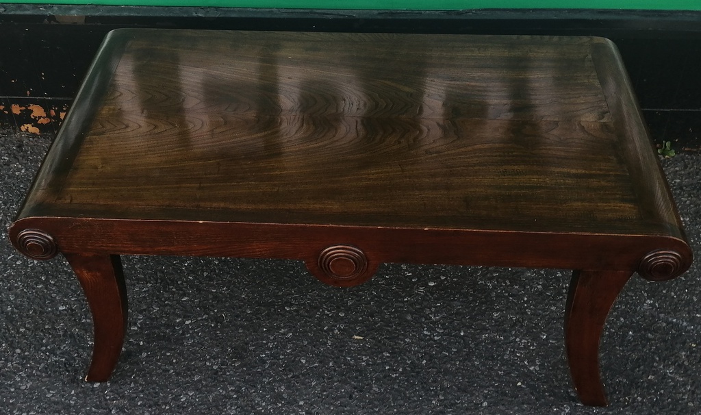 Dark wood scrolled coffee table