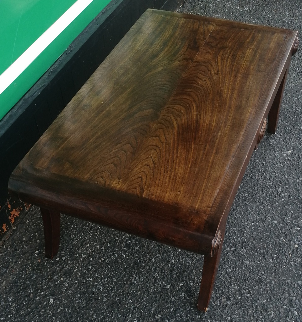 Dark wood scrolled coffee table